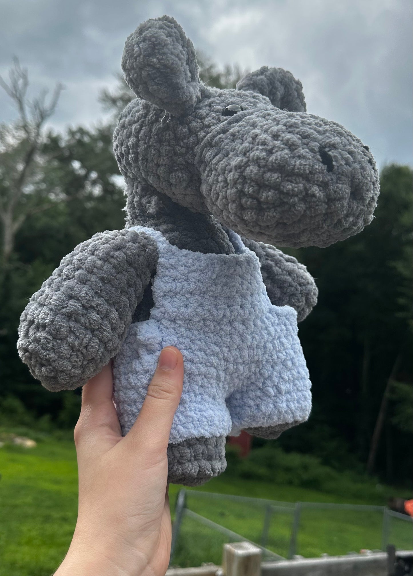 crochet hippo in blue overalls