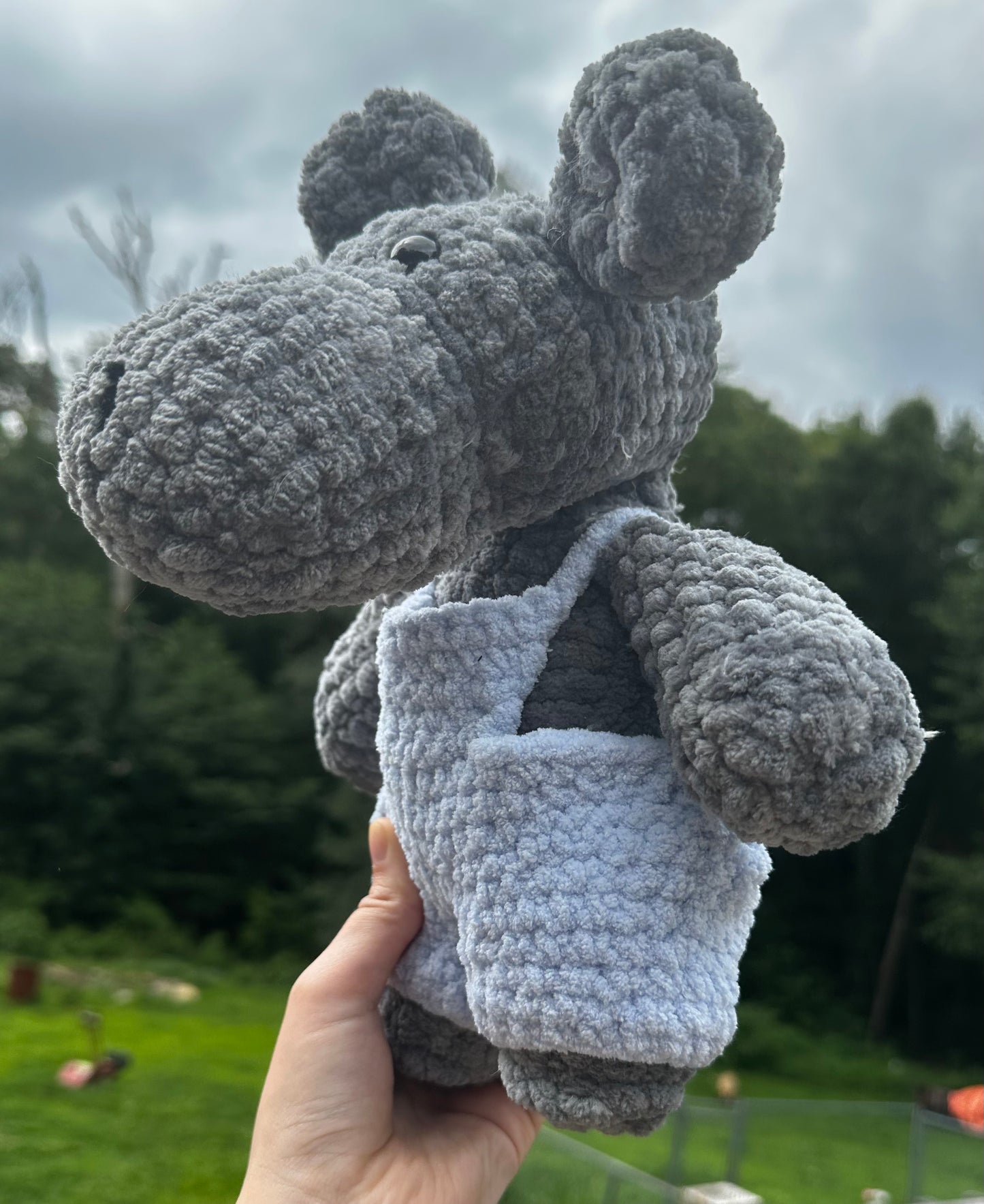 crochet hippo in blue overalls