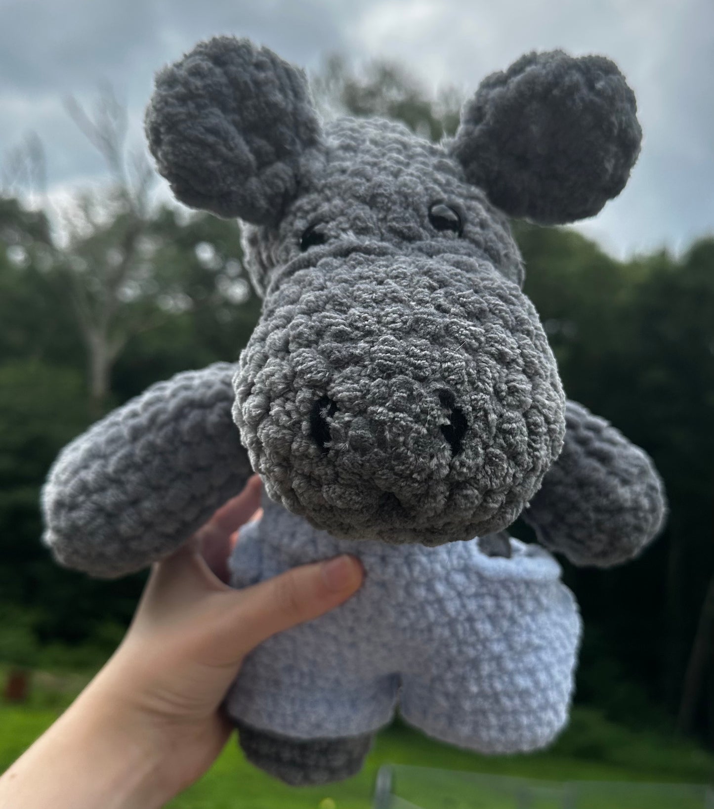 crochet hippo in blue overalls